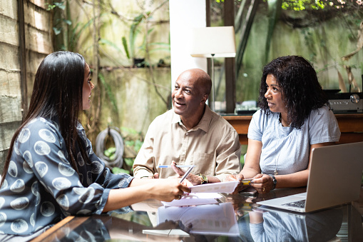Woman speaking with her parents about dental work