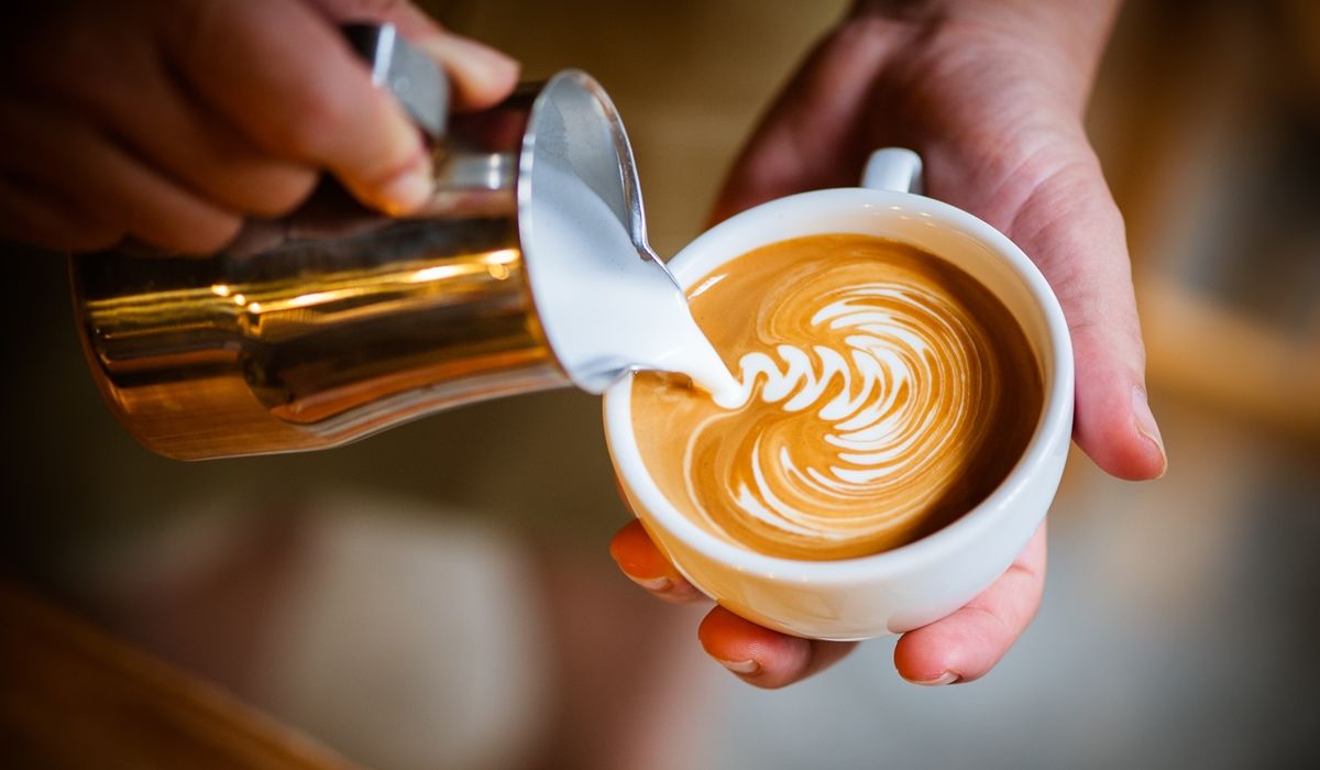 Barista pouring coffee